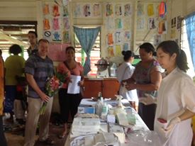 Acting Australian High Commissioner Mr Glen Miles with the Dental Students and Renata Ram at the sterilisation table.